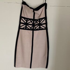 Body con Nude and Black strapless mini dress.